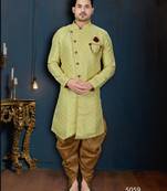 Light-yellow patterned sherwani with ornate buttons, burgundy pocket, and gold trousers.