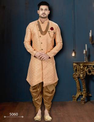 Peach patterned sherwani with pearl accessories, burgundy pocket, and gold trousers. 1