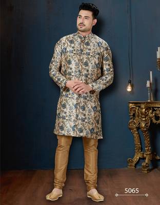 Cream floral sherwani with blue motifs, gold buttons, and gold trousers. 1