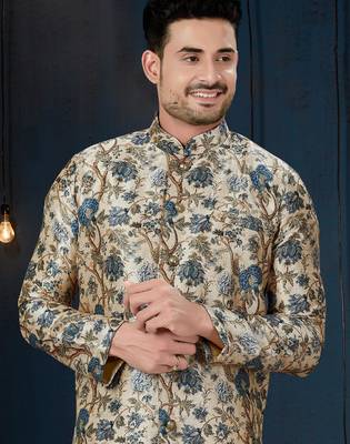 Cream floral sherwani with blue motifs, gold buttons, and gold trousers. 2