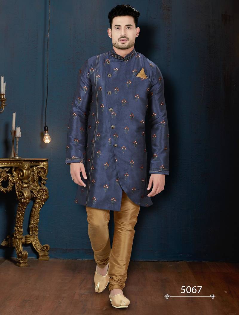 Navy-blue sherwani with floral motifs, gold detailing, and matching pocket square.