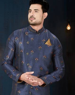 Navy-blue sherwani with floral motifs, gold detailing, and matching pocket square. 2