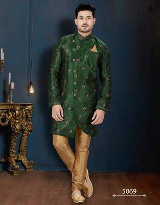 Emerald-green sherwani with floral motifs, gold pocket square, and gold trousers. 1