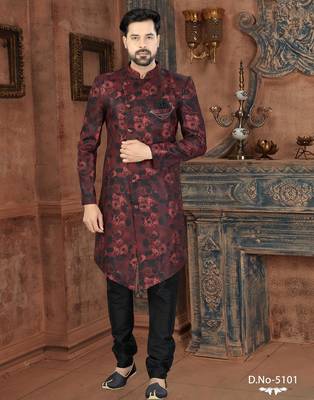 Burgundy floral sherwani with black patterns, chain pocket detail, and black trousers. 1