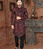Burgundy floral sherwani with black patterns, chain pocket detail, and black trousers.