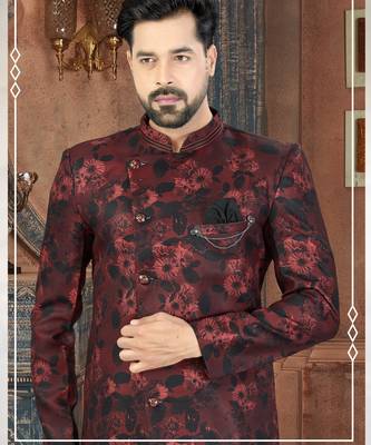 Burgundy floral sherwani with black patterns, chain pocket detail, and black trousers. 2
