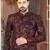 Burgundy floral sherwani with black patterns, chain pocket detail, and black trousers.