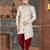 Off white floral sherwani with coral pocket accent and red trousers.