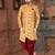 Mustard floral sherwani with burgundy pocket square and matching trousers.