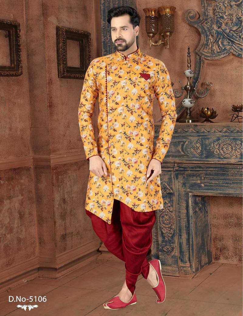 Mustard floral sherwani with burgundy pocket square and matching trousers.