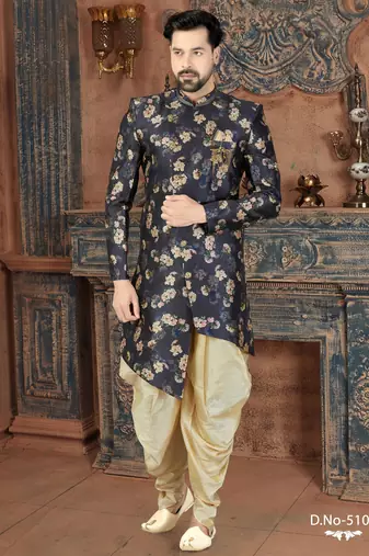 Navy floral sherwani with embellished pocket and ivory dhoti-style trousers.