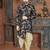 Navy floral sherwani with embellished pocket and ivory dhoti-style trousers.
