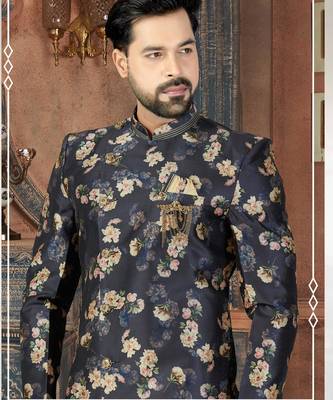 Navy floral sherwani with embellished pocket and ivory dhoti-style trousers. 2