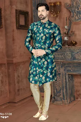 Teal floral sherwani with matching pocket square and ivory trousers.