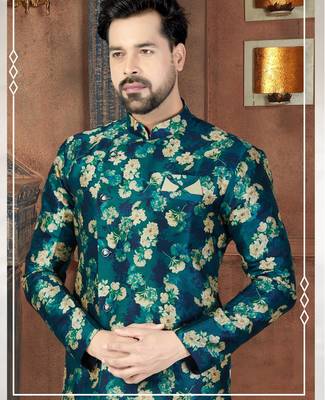 Teal floral sherwani with matching pocket square and ivory trousers. 2