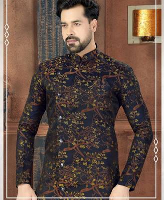 Dark blue sherwani with gold-rust botanical patterns and gold trousers. 2