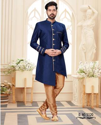 Beige sherwani with striped cuffs, chain pocket detail, and brown trousers. 1