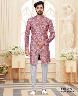 Dark-maroon-and-white patterned sherwani with asymmetrical front, with white trousers. 1