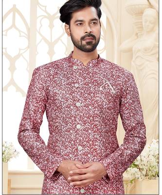 Dark-maroon-and-white patterned sherwani with asymmetrical front, with white trousers. 2