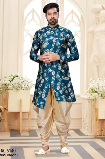 Teal floral sherwani with matching pocket square and cream dhoti-style trousers.