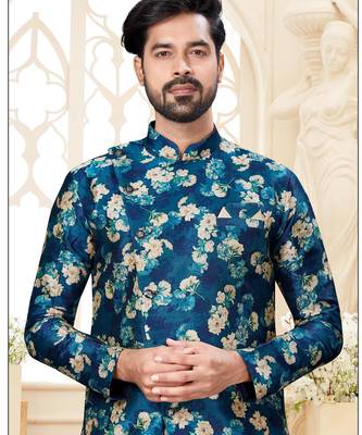 Teal floral sherwani with matching pocket square and cream dhoti-style trousers. 2