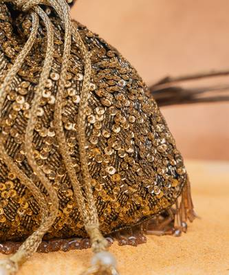 Antique gold silk embroidered shimmer viel potli bag 3
