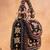 Black charm wine silk embroidered hand bag