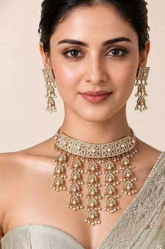 Gold plated handcrafted jadau necklace set with pearl tassels