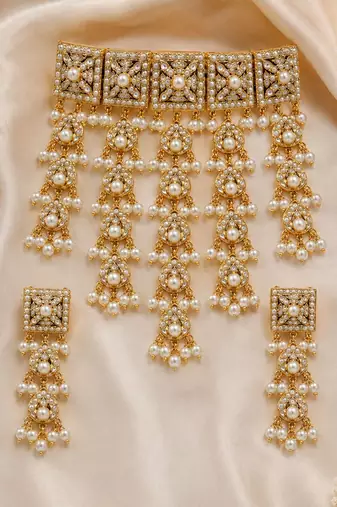 Gold plated handcrafted jadau necklace set with pearl tassels