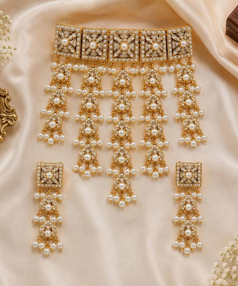 Gold plated handcrafted jadau necklace set with pearl tassels