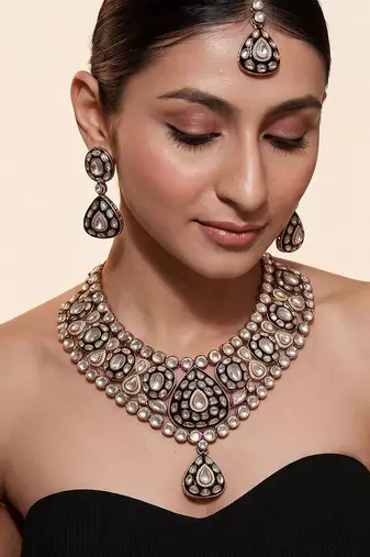 Gold plated kundan polki necklace set with maang tikka and earrings