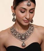 Gold plated kundan polki necklace set with maang tikka and earrings