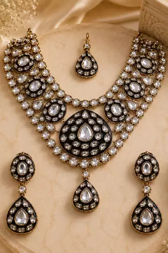 Gold plated kundan polki necklace set with maang tikka and earrings