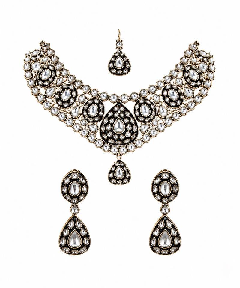Gold plated kundan polki necklace set with maang tikka and earrings