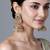 Gold plated emerald green jadau pearl jhumka earrings