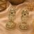 Gold plated emerald green jadau pearl jhumka earrings