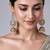 Gold plated emerald green stone jadau pearl jhumka earrings