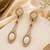 Gold plated ivory semi precious dual stone drop earrings