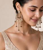 Gold plated metallic kundan tassel earrings
