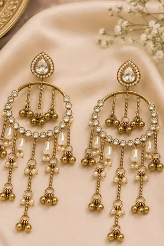 Gold plated metallic kundan tassel earrings