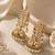 Gold plated jadau pearl jhumka statement earrings