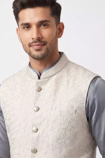 A loyal white cutdana embroidered nehru jacket