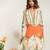 Ivory and tangerine orange embroidered organza and crepe kurta set