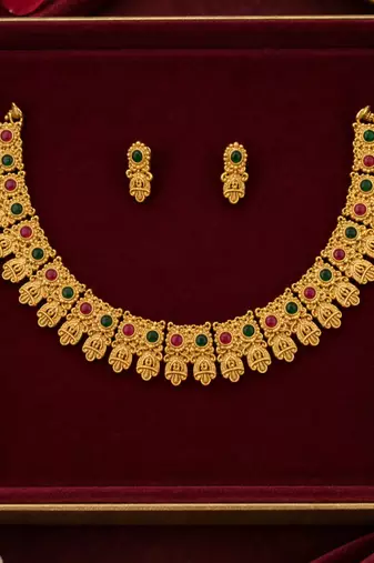 gold-tone traditional necklace set with pink and green stones