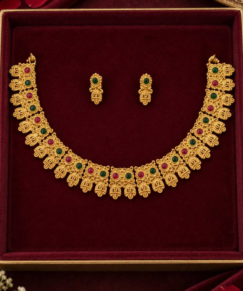 gold-tone traditional necklace set with pink and green stones