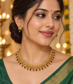 traditional gold-tone necklace with ruby and green stone drops