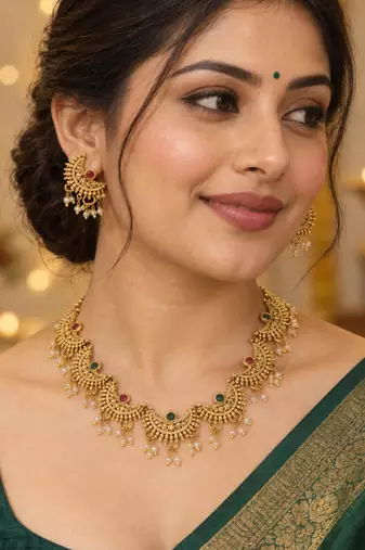 traditional chaand motif necklace set with pearl drops