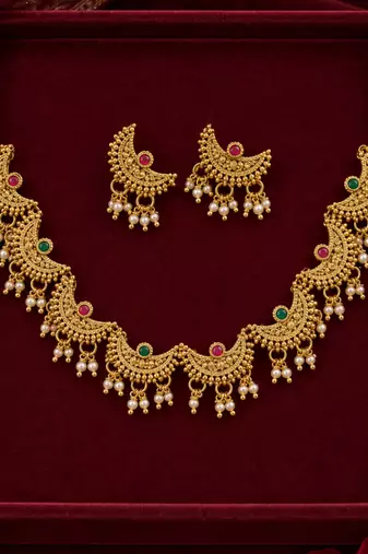 traditional chaand motif necklace set with pearl drops