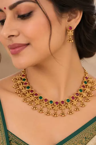 antique gold-tone necklace set with ruby and green stones