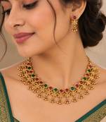 antique gold-tone necklace set with ruby and green stones
